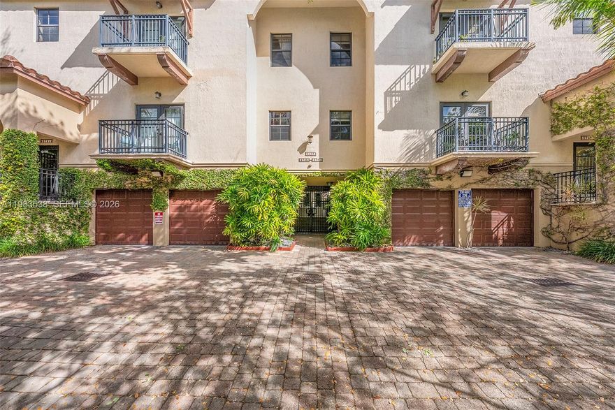 Rarely available Mediterranean style 2 bed / 2.5 bath townhouse for lease in Villaggio in the Grove. This tri-level residence features a 2-car garage on the first level along with additional storage and a climate-controlled flex space ideal for a home office or gym. The main living level includes an updated kitchen with granite countertops and stainless steel appliances, a half bath, and marble flooring. Upstairs provides two spacious bedrooms with en-suite baths and walk in closets.  The property has impact windows and doors throughout. Enjoy the ideal Grove lifestyle with the ability to walk to nearby parks, restaurants, marinas, and the village center.