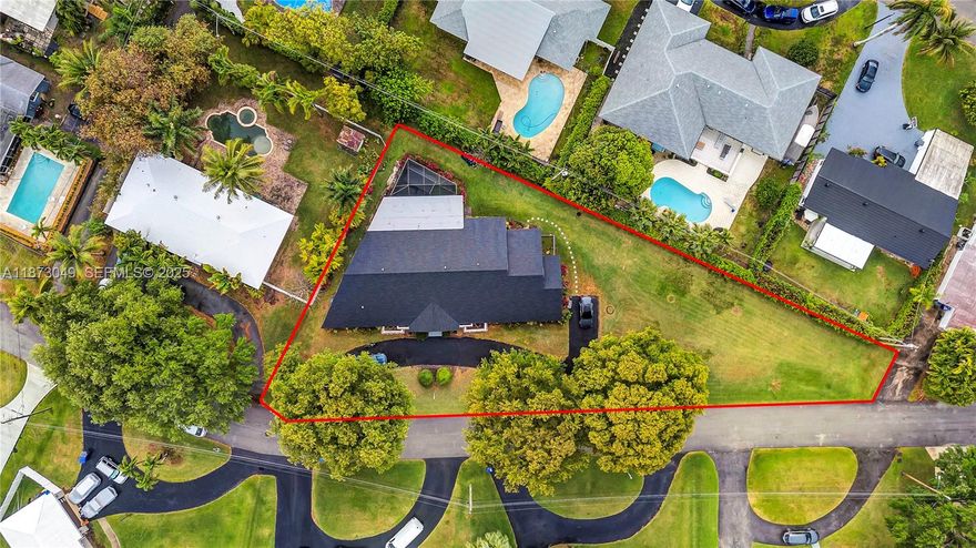 6 BEDROOMS and 4 BATHROOMS, state of the art exercise pool home for sale! Huge buildable double lot, rare find in Hollywood! Expand the existing 3,500sq home or build an additional guest house. Brand new roof and impact windows. 
Excellent opportunity for large families or for multi-generational living, with a separate, large in-law suite. Great layout with custom finishes, gorgeously updated kitchen with a large center cooking island, white custom made cabinets and imported quartz counter top. The modern exercise pool and the brand new 8 person jacuzzi awaits the family on the screened in patio. 
Plenty of space to entertain and relax under a lush canopy of trees. Oversized, 14,000sq, rare double lot allows to build an addition and expend the home, add a playground, etc. Parking for 6+ cars, RV, boat. Centrally located, close to hospitals, I95, beaches, golf course. Great investment property, excellent potential and upside to convert into an assisted living facility, group home or an Airbnb/short term rental. Schedule a showing today!