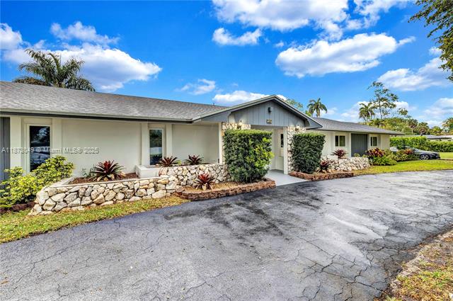 Nestled on a spectacular, tree-lined site in a quiet, low traffic street next to the Orangebrook golf course, this beautifully remodeled, on-trend oversized home is truly remarkable in every way! An appealing layout and stunning custom finishes highlight the main area along with a gorgeous kitchen with a large center cooking island, white custom made cabinets and elegant imported quartz counter top. The 2 spacious master suites, 4 additional guest rooms, and 4 bathrooms fulfill any need of a large family at this 3,500+ sq home. The brand new 8 person jacuzzi and the state of the art sport pool completes the pictures to relax the senses and body outdoors, under a lush canopy of trees. Brand new roof and impact windows. Plenty of space to park, RV, boat ok. Oversized, rare double lot.