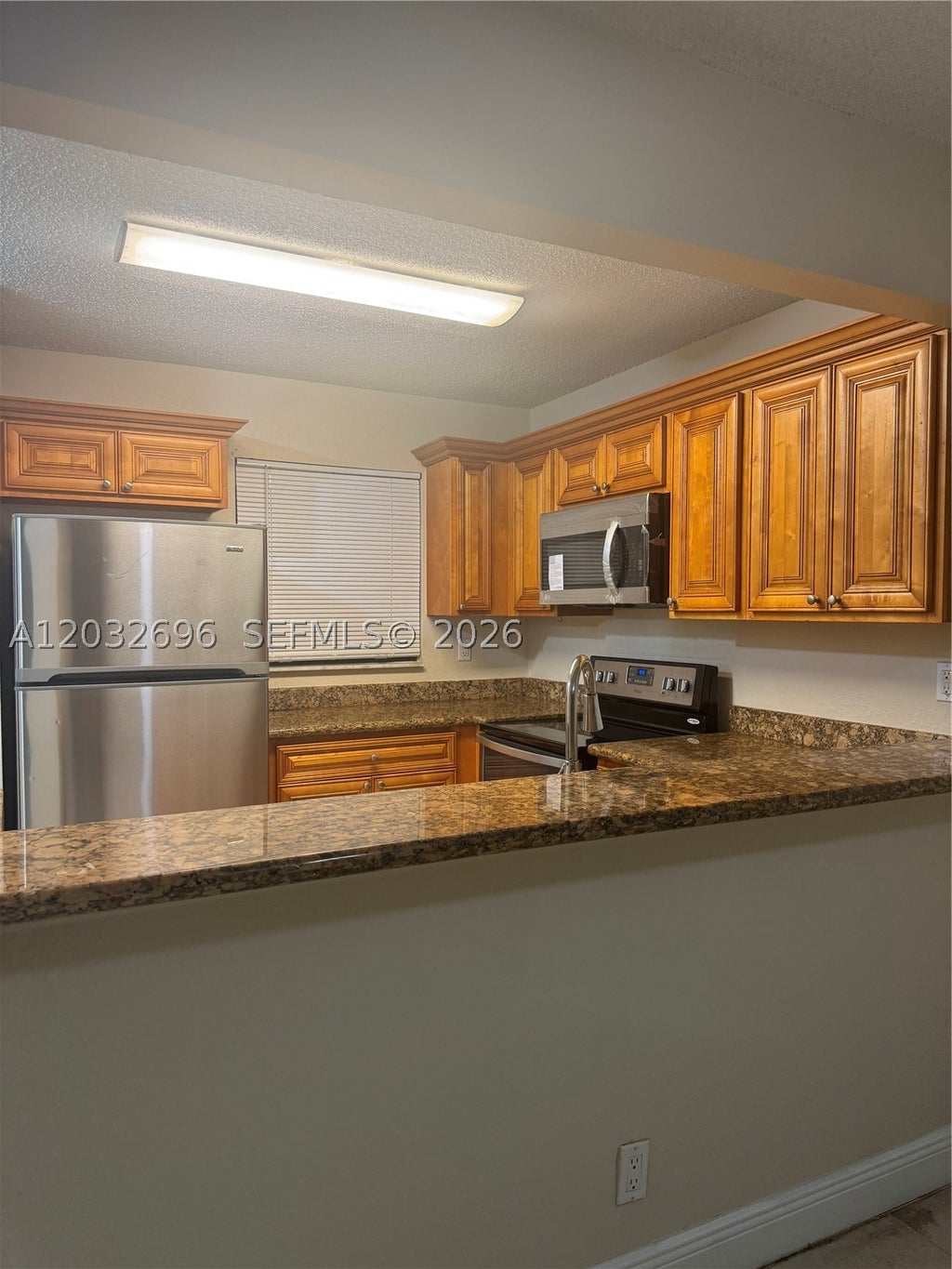 Photo of 1640 Windorah Way #D, West Palm Beach, FL 33411 (MLS # A12032696)