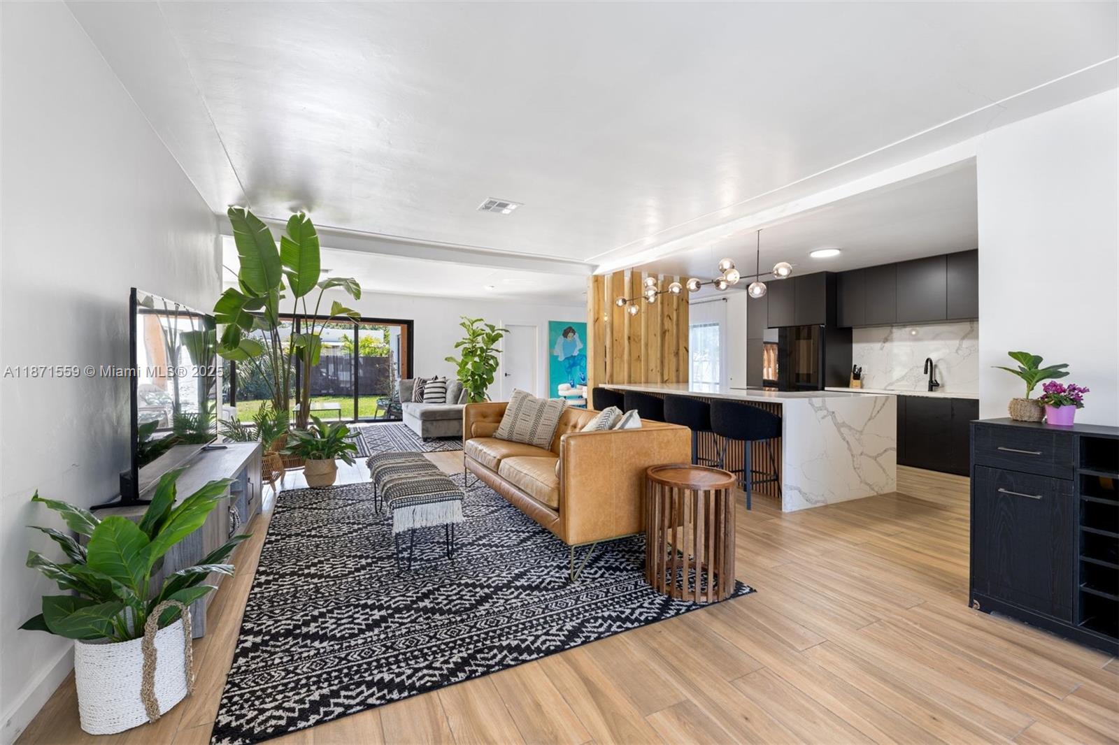 Completely renovated 3-bedroom, 2-bathroom home featuring a spacious open layout, modern finishes, and abundant natural light. This move-in ready residence includes a garage for convenience and storage, plus pre-approved plans for a pool—offering the perfect opportunity to create your own backyard oasis. A rare find that combines style, functionality, and future potential.