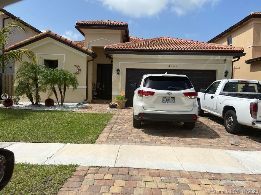 This cozy one story home is located in an established Homestead neighborhood (AVALON). This property features Curved/S Tile roof, a beautiful garden, a covered entry, a living room and a formal dining room, 3 bedrooms, 2 baths, ceramic and carpet floors, open kitchen with granite counter top, stainless steel appliances, laundry room, walk-in closet, all lamps are included, large screened porch to relax or for entertainment. Both sides of the house features cement floors, fenced patio. Completed panel/shutters. This property is close to Homestead Baptist Hospital, the Turnpike, Walmart, banks, hotels, supermarkets and shopping centers. SALE DOES NOT INCLUDE: cameras or shed. The shed is for sale for $2,000. Must see!
