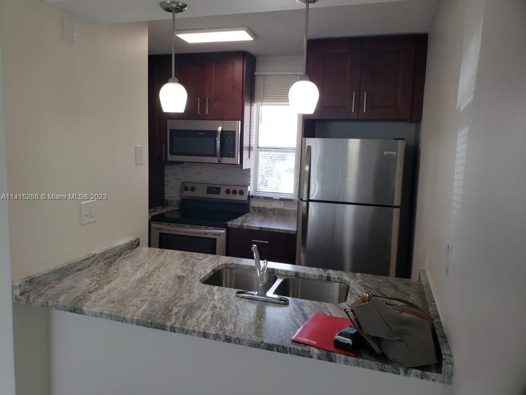 Photo of 9909 Twin Lakes Dr #26-F, Coral Springs, FL 33071 (MLS # A11415288)