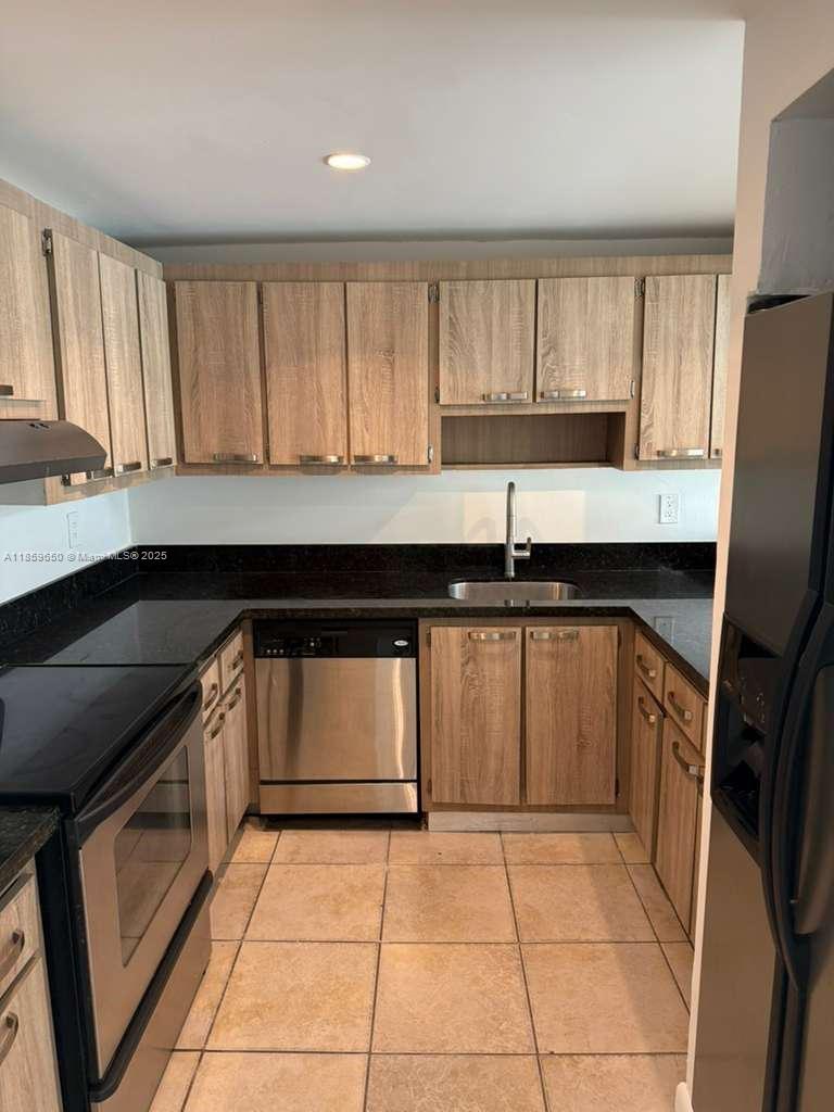 Beautiful 1 bedroom apartment in Coral Gate East ! All tile floors, updated kitchen cabinets with granite countertops, freshly painted, updated bathroom, impact windows and much more !