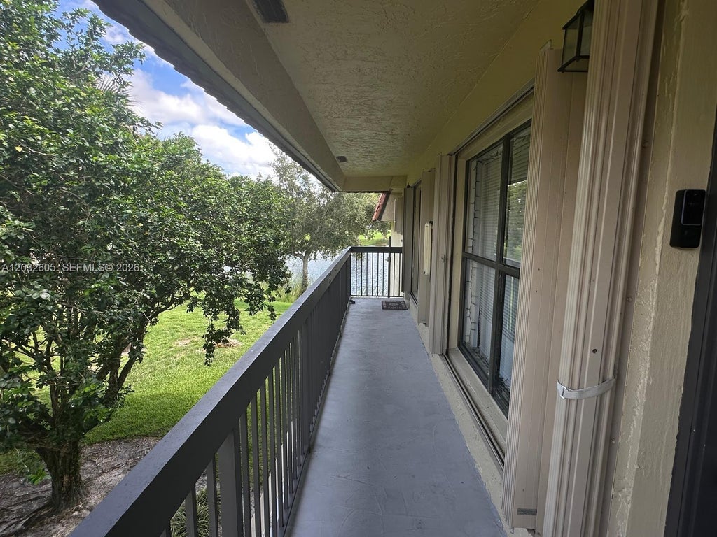 Photo of 10050 NW 6th St #202, Pembroke Pines, FL 33024 (MLS # A12032605)