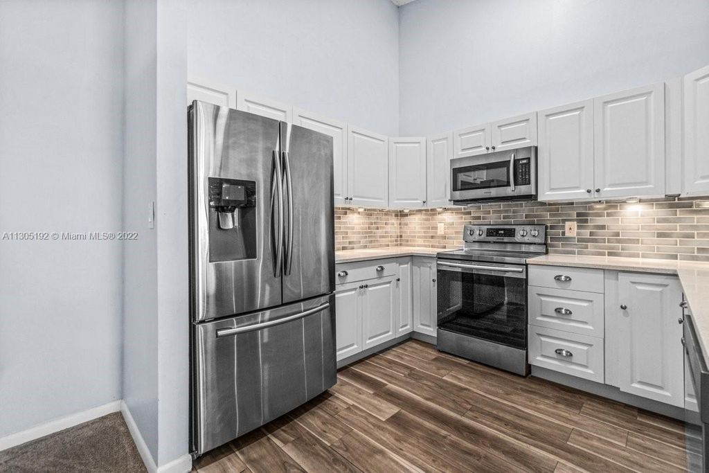 Photo of 6535 Chasewood Dr #H, Jupiter, FL 33458 (MLS # A11305192)