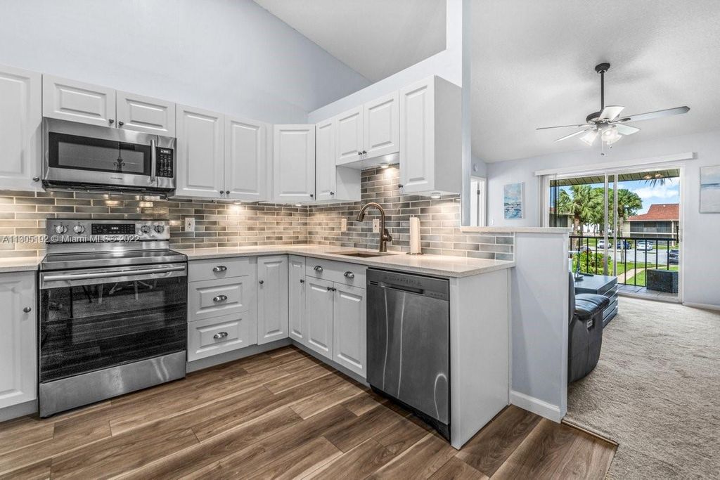 Photo of 6535 Chasewood Dr #H, Jupiter, FL 33458 (MLS # A11305192)