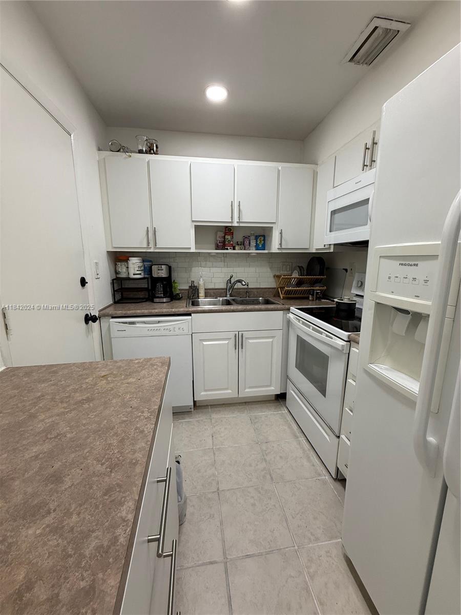 THIS COZY 2/1, 2ND FLOOR CONDO IS IN AN AMAZING LOCATION NEAR THE BEACH AND GREAT RESTAURANTS WHERE YOU CAN FEEL AT HOME. RECENTLY RENOVATED, NEW WOOD FLOORS IN BEDROOMS, KITCHEN REMODELED WITH HIGH CEILING, NEW WATERHEATER, FRESHLY PAINTED WITH PLENTY OF NATURAL LIGHT. UNIT INCLUDES LARGE SCREENED IN PORCH SO YOU CAN ENJOY THE FRESH SOUTH FLORIDA AIR WITHOUT THE BUGS. CONDO FACING WEST FOR LOVELY SUNSETS TO SHARE WITH YOUR FRIENDS. HIGH SPEED INTERNET, CABLE TV AND YEAR ROUND MAINTENANCE INCLUDED. RIVER SHORES HAS HEATED POOL, CLUBHOUSE, GYM, TENNIS, BBQ, CAR WASH AREA, LUSH GARDEN AREA WHERE YOU CAN READ A BOOK ADJACENT TO BEAUTIFUL WATERWAY AND BOAT DOCKS. CENTRAL LOCATION CLOSE TO BANKS, SHOPPING, ENTERTAINMENT, US1