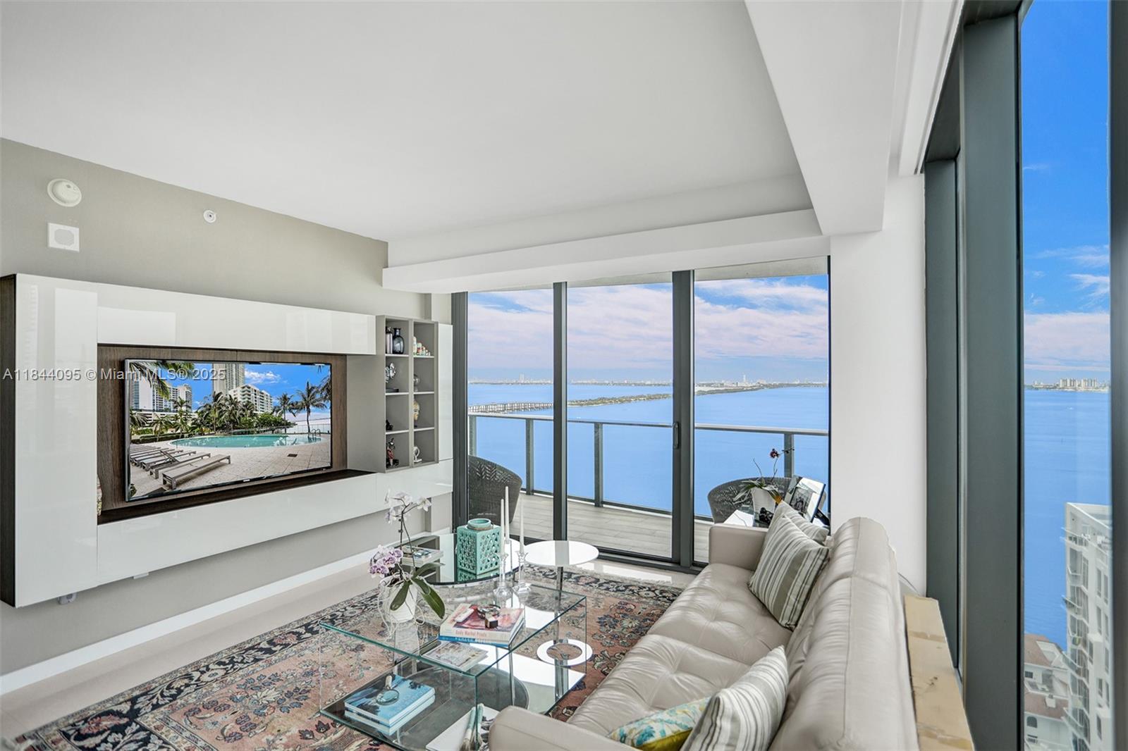 Beautiful corner unit with unobstructed direct views of Biscayne Bay and Miami Beach. 3 Bedrooms, 2 Full Baths, 1 half bath. Porcelain floors, large balcony, 1 parking space. Stunning building with state of the art amenities, bay front park, tennis, pool, gym, sauna, party room and private foyer entrance. Available from September 1, 2025!