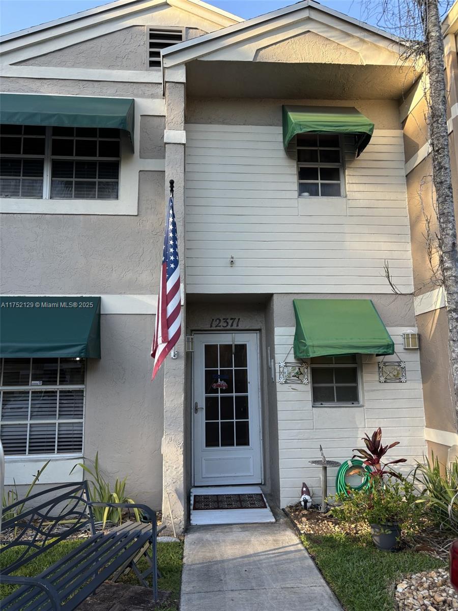 Charming Townhome in the heart of Cooper City - Ready for Your Personal Touch Bright and spacious 2-Bedroom, 2.5-Bathroom Townhouse with Potential for Modern Updates. The roof was replaced in 2018. Both primary suites are located upstairs, and each features its own full bathroom. Fenced in back patio which is great for entertaining. Low HOA fees include pool, common area maintenance and exterior painting. Flamingo Park is right across the street from the complex which offers basketball and tennis ball courts.