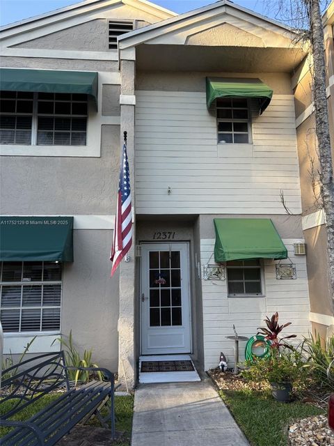 Photo of 12371 SW 52nd St, Cooper City, FL 33330 (MLS # A11752129)