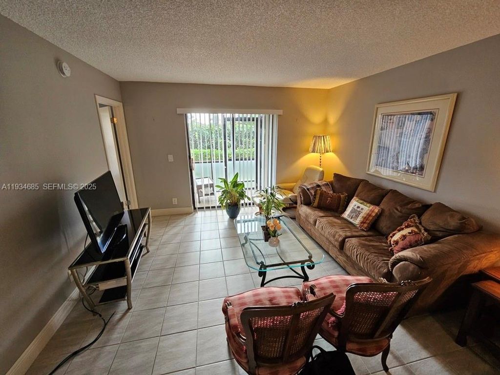 Photo of 7118 Golf Colony Ct #103, Lake Worth, FL 33467 (MLS # A11934685)