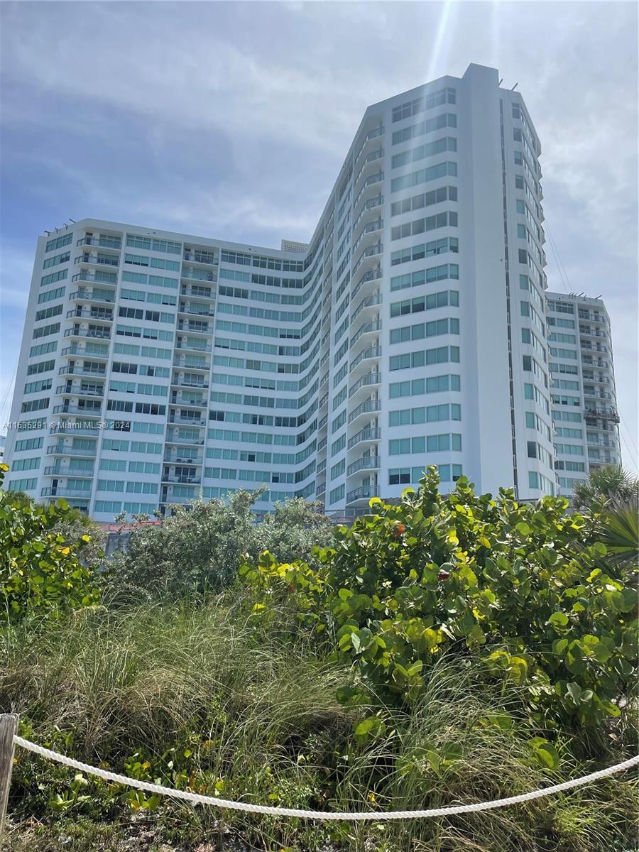 INCREDIBLE OCEAN VIEW! SPACIOUS CONDO WITH 1 BEDROOM, plus a room to convert to a small 2nd bedroom or home office, 2 FULL BATHROOMS for convenience. New impact windows throughout. The building offers a range of amenities, including a newly renovated pool and pool deck, a game room, a social/card room, and an exercise room. For special occasions, residents can reserve the social room for private events. Parking spaces can be rented on a first come-first serve basis. Covered spaces are $425/year and uncovered spaces are $400/year. Note: The building is pet-free, ensuring a peaceful and quiet living environment.. All outstanding special assessments will be paid by the seller at closing.