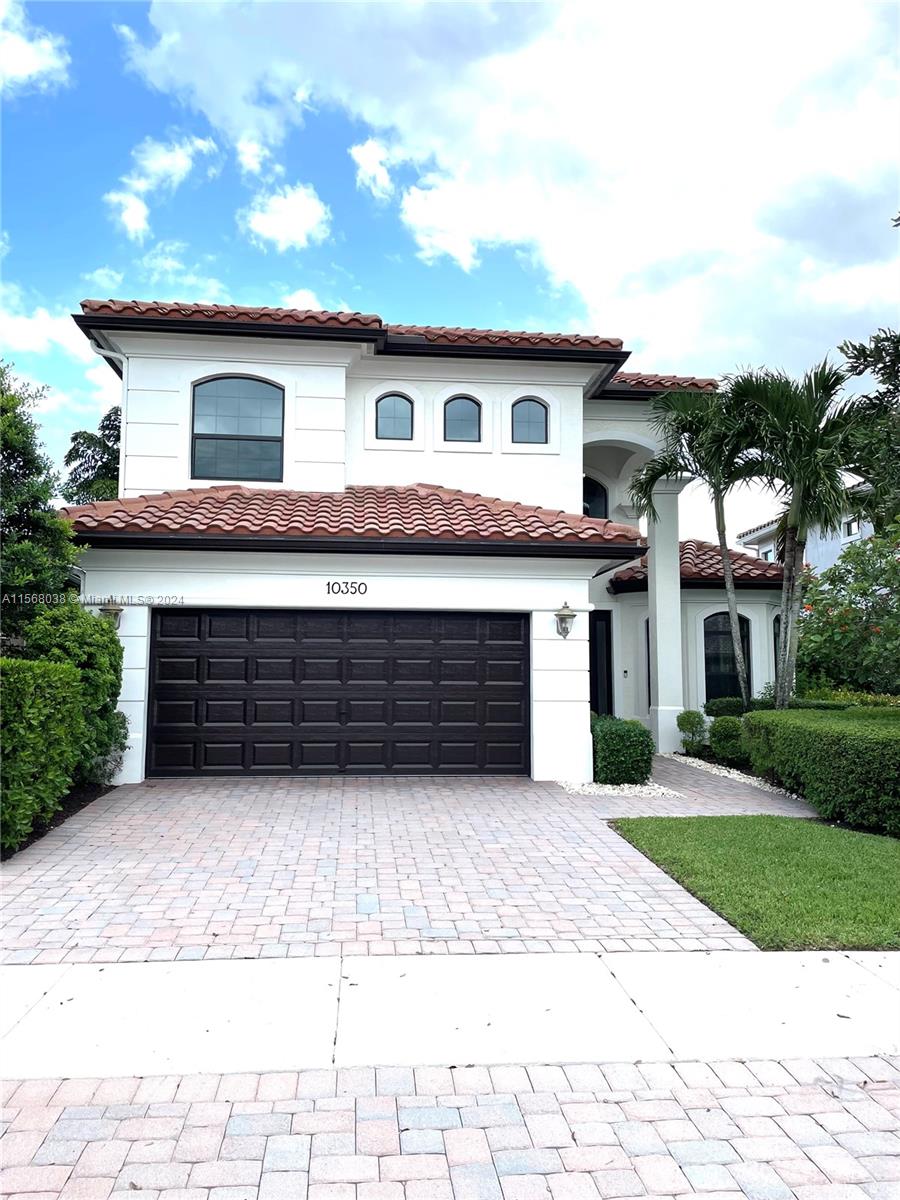 Parkland Golf Country Club -Beautiful Tuscan-style home with 5 beds & 3 baths (5th bed used as office/multi-purpose room). Imagine waking up every morning or sitting on your back patio while taking in a magnificent & serene water view. The home also features a wonderful pool w/built-in sound system in the lanai ideal for entertaining outdoors. 2 brand new A/C units. Indoor security system, crown molding throughout, fenced-in yard, open concept floor plan w/vaulted ceilings perfect for memorable gatherings. Kitchen w/stainless steel appliances & lovely espresso cabinets, granite countertops, breakfast bar, diagonal tile floors throughout main living areas. Stunning stairway w/wrought iron & immaculate espresso hardwood floors in loft (upper level). Impact glass windows. Ext painted in 2019.