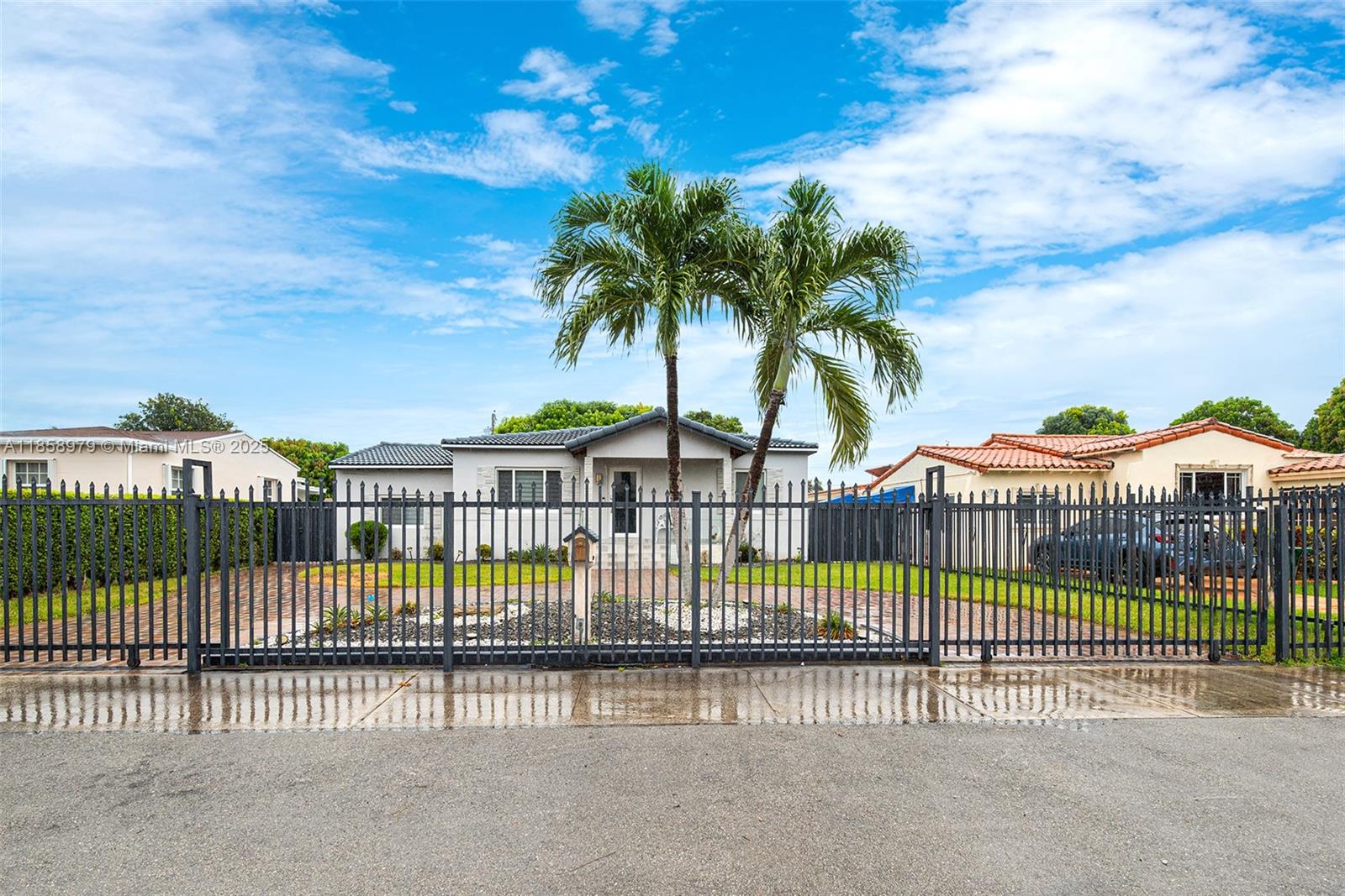 Welcome to this beautifully updated 4/2 Authentic Miami home, where timeless charm meets modern elegance! Built to last w/ quality craftsmanship, this residence features a gated front entrance, a stunning paver driveway, & lush tropical landscaping.Inside, you’ll find an inviting layout w/ a spacious living room, a sleek modern kitchen boasting high-gloss cabinetry, quartz countertops, stainless-steel appliances & stylishly renovated bathrooms w/ designer finishes.The expansive fenced backyard offers the perfect outdoor retreat, complete w/ a covered patio & full exterior kitchen, ideal for entertaining.The property provides plenty of space for family fun, gardening, or potential rental income opportunities $$ This property is a rare combination of comfort, style, and investment potential!
