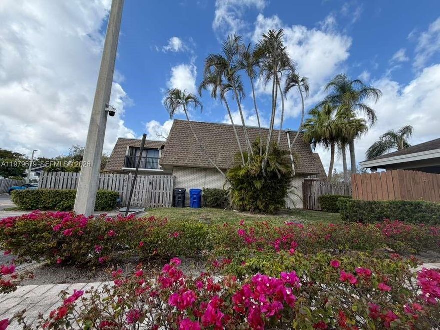 Remodeled corner townhome with 2 bedrooms and 2.5 bathrooms. No rental restrictions or credit history required. Minimum 20% down payment (no reservation). This beautiful home includes brand new appliances, including a stove, refrigerator, dishwasher, washer, dryer, and garbage disposal. It also features new flooring and modern bathrooms. The updated kitchen boasts a new sink, elegant gold fixtures, and a modern glass backsplash, giving it a stylish and contemporary look. The private, fenced front yard includes a mango tree, perfect for enjoying fresh fruit at home. The property also features a security system and hurricane shutters for added convenience and protection. Assigned parking spaces are located near the front door and the community pool. The community is pet-friendly and offers a pool, outdoor security, and included water. Excellent location near schools, shopping centers, restaurants, and major highways.