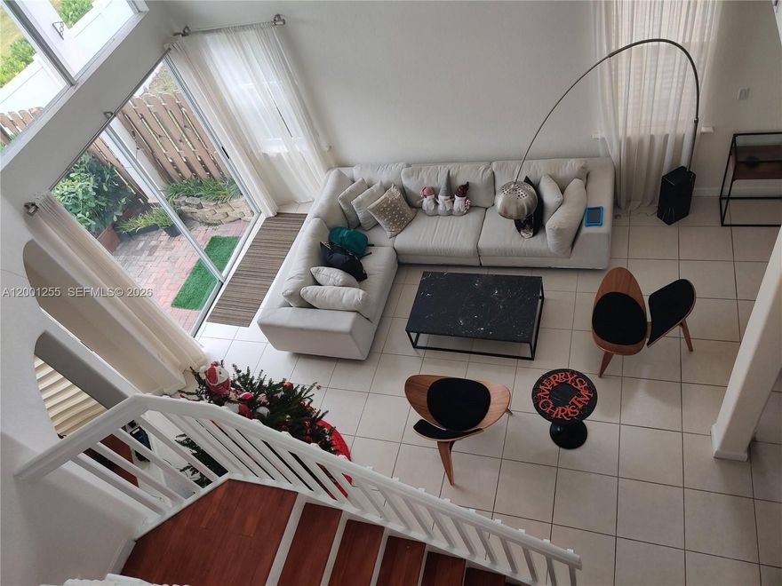 Beautiful corner unit in the gated community of Netherlands in Doral. 4 bedrooms, 2.5 baths. Large Master with sitting area, built-in walk-in closet, high volume ceilings, family room, formal dining room, granite countertop kitchen, breakfast area tile floors downstairs, bamboo wood flooring on second floor, separate laundry room, washer/dryer, garage has mini split A/C unit, fenced backyard.