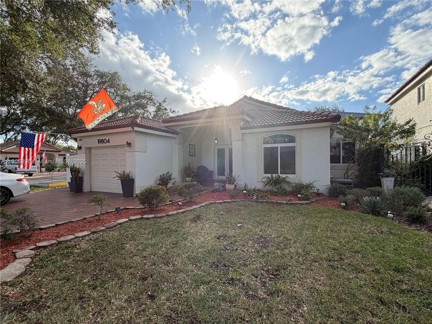 Welcome home! This Meticulously well-maintained 3 Bed 2 Bath home is nestled on a corner lot in the highly sought after gated community of Marbella Park. Centrally located to major Highways, Shopping, and Dining. Key features include; Natural Gas powered Kitchen Range, Dryer and Water Heater. California Closet in the Primary Closet, Porcelain Tile throughout, Fully updated Kitchen, Bathrooms, Impact Windows and Doors in addition to a Fully Paved Patio Yard. The extended insulated and well-lit terrace is ideal for family gatherings and entertaining. The Patio is fully secured with PVC fencing. The home is conveniently located next to guest parking. The Low HOA dues include 24hr Gated security, Community Pool, and Lawn maintenance for the front of the house. Move-in ready and priced to sell.