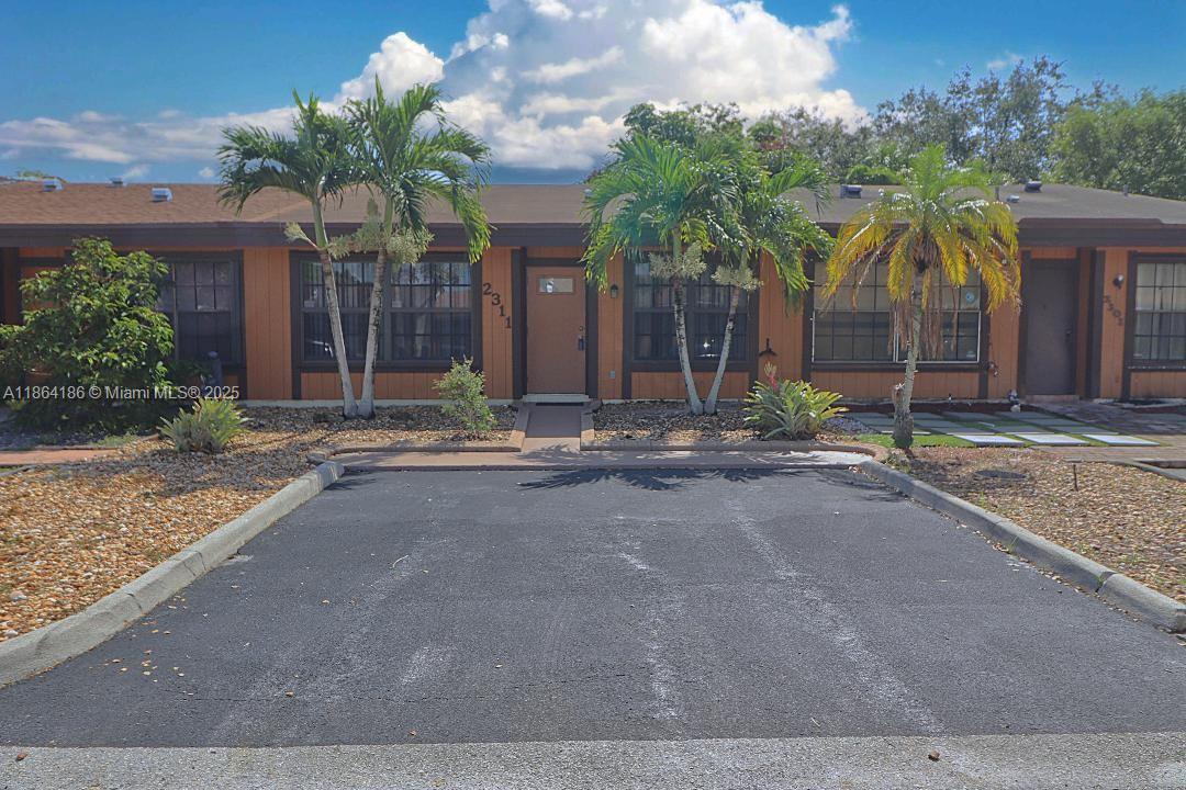Shows great, Priced right, Updated kitchen and appliances, Tile & wood laminate floor, Remodeled baths, Impact front windows and door installed 2022, Spacious bedrooms, Storm panels for back sliding doors, New roof installed 2020, Current drywood termite warranty, Decorative landscape border with minimal yard maintenance, Fenced lot, No renting allowed for 2 years