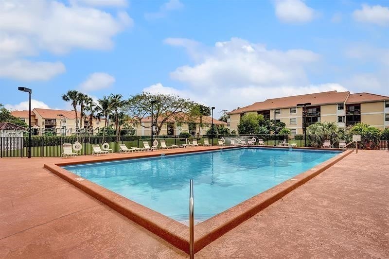 Photo of 5721 Riverside Dr #103B5, Coral Springs, FL 33067 (MLS # A12042772)