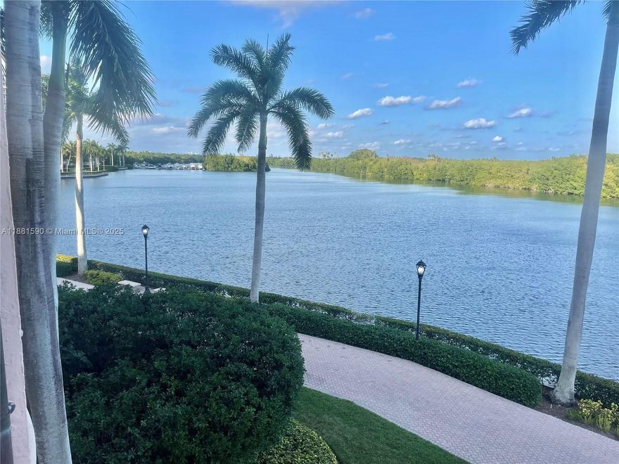 Majestic lagoon water views from this rarely available rental with over 4,000 sq ft of spacious sophistication at its best. Floor to ceiling upgraded windows and sliding glass doors with natural light flowing thru open living, dining, kitchen and family room. Special designer features like Wet Bar, Sparkling light marble floors, Surround Sound, updated window treatments, wrap-around balconies and split plan with 4 bedrooms. Expansive primary bedroom with 2 separate baths, closets, private office and picturesque balcony. Great opportunity to live in Deering Bay Yacht and Country Club in Coral Gables and experience all its amenities. Furnished or unfurnished option. 24/7 top-tier security.
