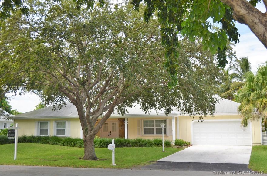 Beautiful Home ready to move in! This spacious Country Walk home sits on a quiet, low traffic street and features 4 Bedrooms, 2 full baths with an amazing open floor plan, updated bathrooms, 18" tile throughout, formal dining, living and Florida rooms, 2 car garage, large yard with 29 x 28 screened in porch with vaulted ceilings and fans, perfect for entertaining. Home is centrally located near restaurants, clubhouse and highways. Community offers a pool,gym,tennis courts,clubhouse,security and much more!! Easy to show.