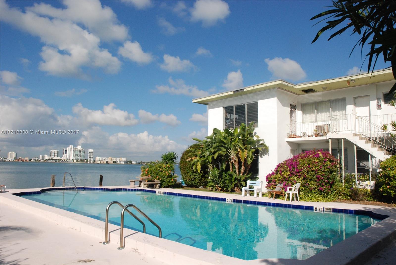 The one you've been waiting for: Live on the water in this small bayfront building with pool. This residence has incredible direct bay views from every room. Just redone with porcelain plank floors, brand new kitchen and bathroom, laundry in unit, generous closet space. These direct bay end units are nearly impossible to find! Quiet street on Normandy Isle.