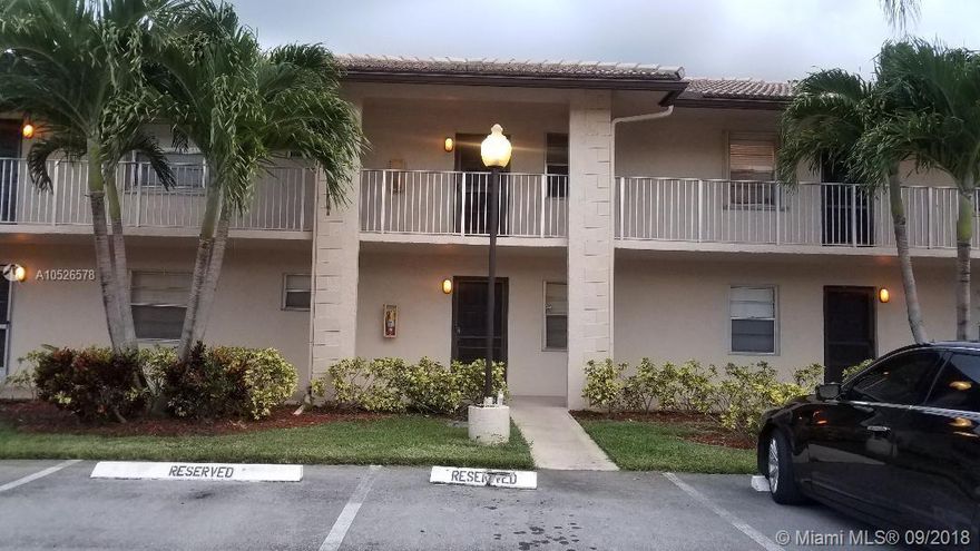 Beautiful 1st floor home overlooking the lake! All Ages community with clubhouse and shuffleboards. Master has 2 closets including a huge walk-in! This is a private gated community. Being sold with or without furniture. Washer and drying inside unit. Hurricane Shutters  A/C was replaced in 2016!!! Walking distance to Wal-Mart plaza with lots of shopping and restaurants and much more! Parking spot directly in-front of unit with additional guest parking available. Sit on porch and relax overlooking the lake and fountain! Call today to show!!!