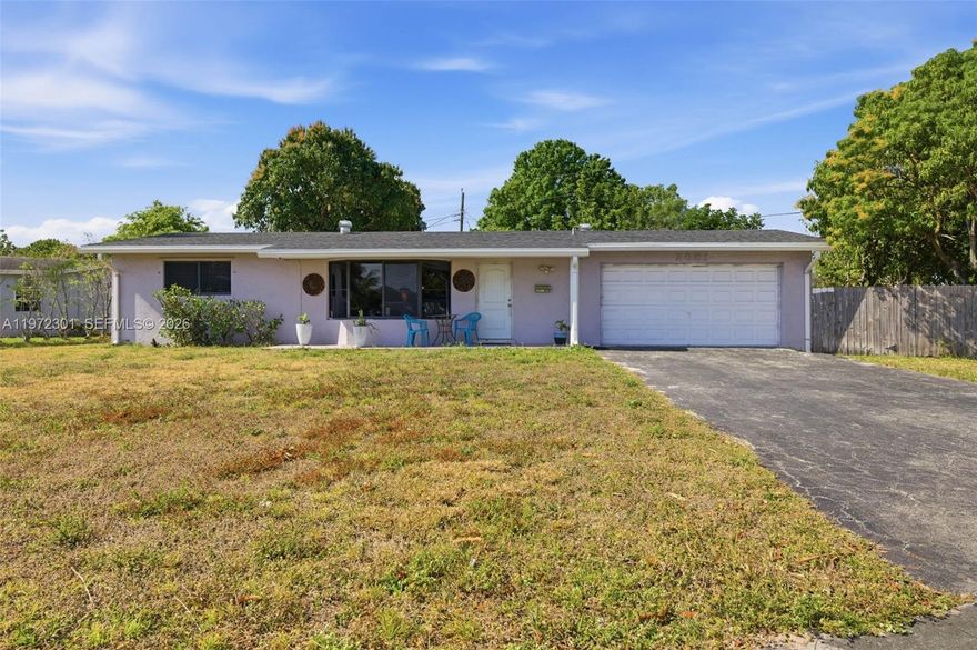 Opportunity knocks to own one of the best priced real estate investments with this 3BR/2BA corner lot home that features hurricane impact windows and a new roof installed 2023 that will save you $1000's of dollars from your home owners insurance. In addition the property features a very spacious living room area with an open kitchen that has been remodeled and has a granite counter top island for convenience and food preparations when entertaining. Additional features are stainless steel appliances, wood laminated flooring throughout, Florida room for extra living area space, split A/C unit in one of the grand bedrooms, remodeled showers, ceiling fans, french door leading to the Florida room, tankless water heater, and well water sprinkler system. Exterior features fruit trees and an all around fence.