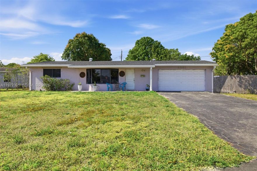 Opportunity knocks to own one of the best priced real estate investments with this 3BR/2BA corner lot home that features hurricane impact windows and a new roof installed 2023 that will save you $1000's of dollars from your home owners insurance. In addition the property features a very spacious living room area with an open kitchen that has been remodeled and has a granite counter top island for convenience and food preparations when entertaining. Additional features are stainless steel appliances, wood laminated flooring throughout, Florida room for extra living area space, split A/C unit in one of the grand bedrooms, remodeled showers, ceiling fans, french door leading to the Florida room, tankless water heater, and well water sprinkler system. Exterior features fruit trees and an all around fence.