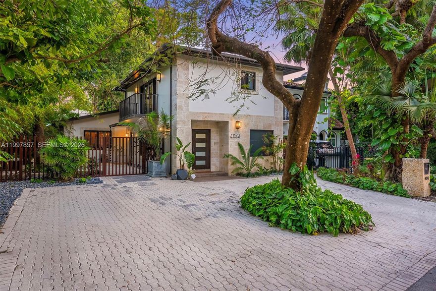 Located on one of the most coveted streets in South Grove, this charming gem blends timeless appeal with thoughtful modern upgrades. The home features a 2023 aluminum roof, impact windows and doors, and a beautifully renovated open kitchen with stunning stone countertops, custom wood cabinetry, stainless steel appliances, and a breakfast bar with seating, all seamlessly flowing into the dining area.
The layout offers two bedrooms and 1.5 baths on the first floor, while upstairs you’ll find a spacious primary suite complete with a private balcony, two separate walk-in closets, and a spa-like bathroom featuring a rain shower enclosed in frameless glass.
Surrounded by lush, mature landscaping, the property also features a fabulous stone firepit on the side patio, perfect for cozy evening gatherings. The backyard is finished with artificial turf and offers ample space to add a pool in the future. Ideally located just moments from the Grove’s top schools, restaurants, boutiques, parks, and marinas.