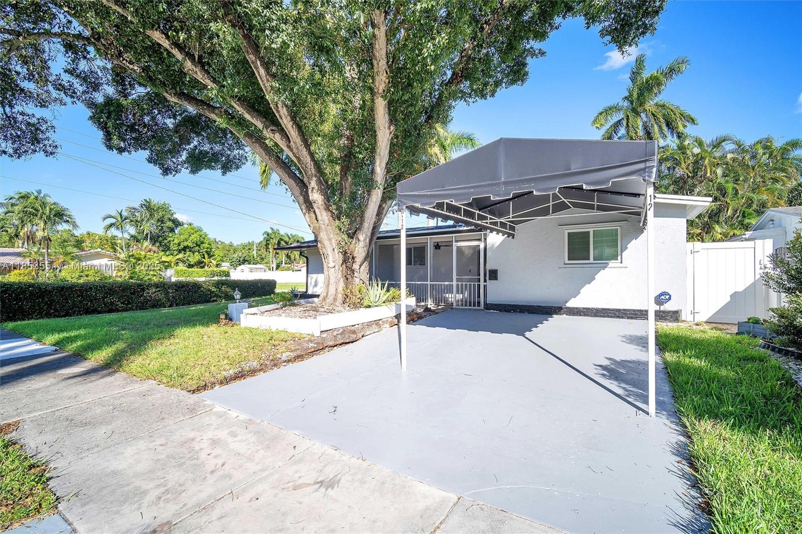 4 Bedroom 2 Bath Home in Hollywood Lakes. Minutes from Hollywood Beach and its famous Boardwalk featuring Margaritaville. A few blocks from a top rated Golf course. Home features Impact Glass, High Security Doors with 5 inch thick Steel. Lovely backyard with Pavered Patio and Upgraded Vinyl Fencing and Solar Lighting. Gas Barbeque Pit. Instant On Gas Water Heater for low energy Use.Property is a corner unit with a rear Driveway for additional parking. Property Being Sold "AS IS".