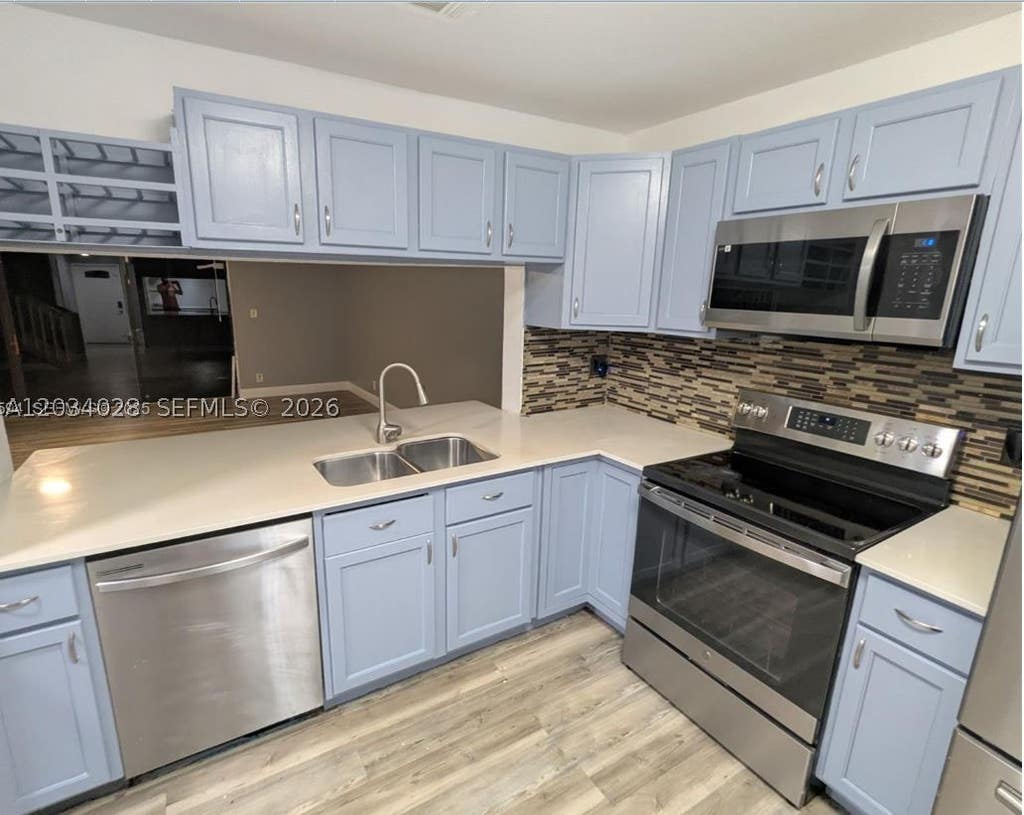 Photo of 4430 NW 92nd Way, Sunrise, FL 33351 (MLS # A12034028)