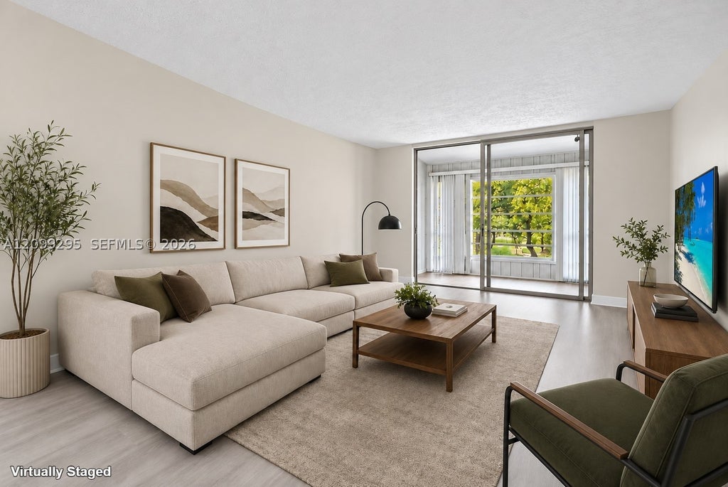 Photo of 1681 NW 70th Ave #309, Plantation, FL 33313 (MLS # A12099295)
