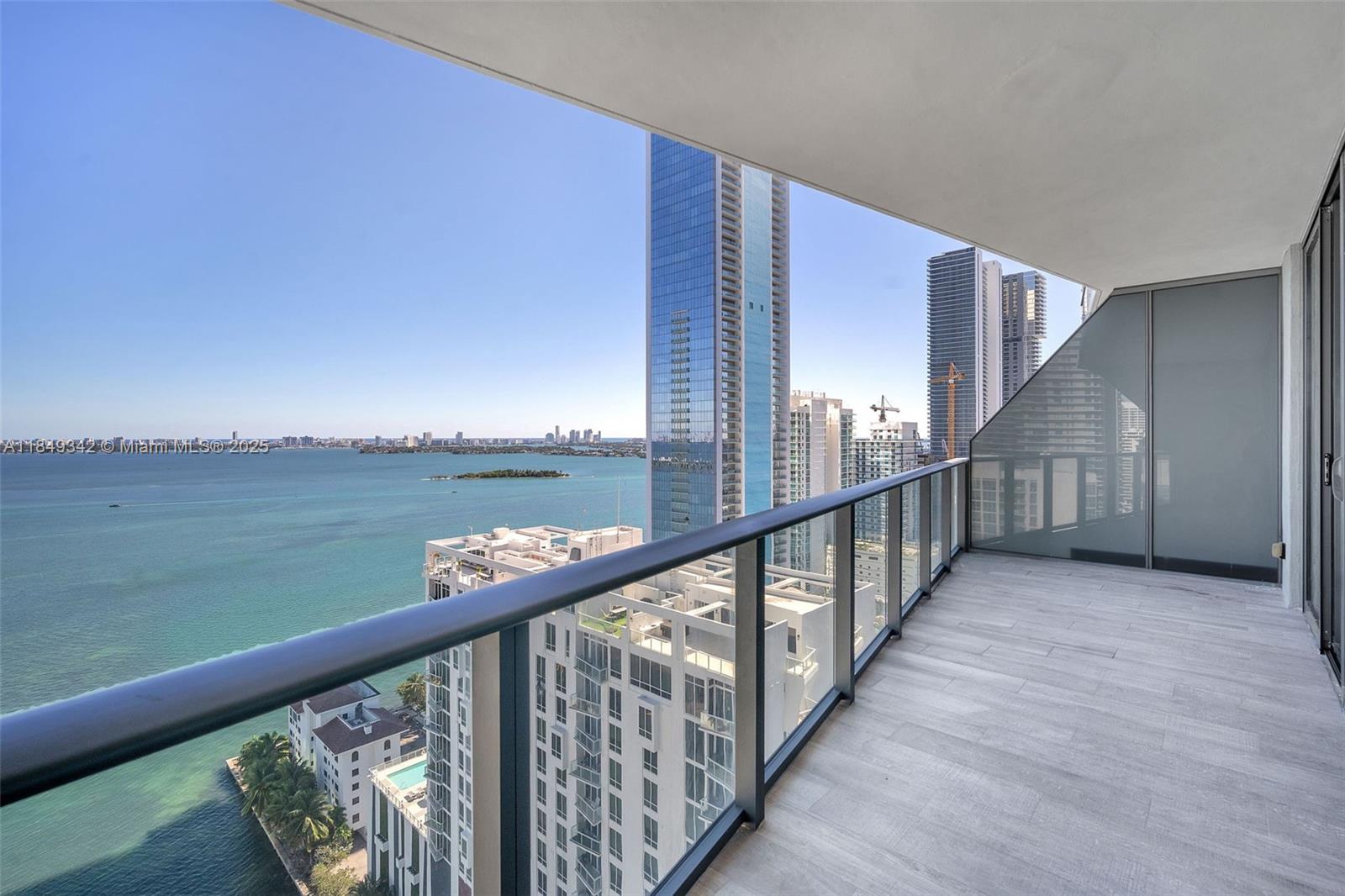 ICONIC upgraded 2 bedroom unit with private elevator foyer and breathtaking bay views. Features porcelain tile floors, high-end kitchen with built-in appliances, ‘Aqua Tru’ water filter, and 4 custom cabinets. Enhanced lighting throughout, custom closets, and unique additions like glass doors in the secondary bathroom, custom washer/dryer and A/C doors, and a TV mount with storage. Huge terrace with electric blinds. Resort amenities include a pool, tennis courts, party room, business center, 24h concierge, and more. Prime Edgewater location, walkable to Wynwood, Midtown, Design District, shops, and restaurants. Live modern luxury!