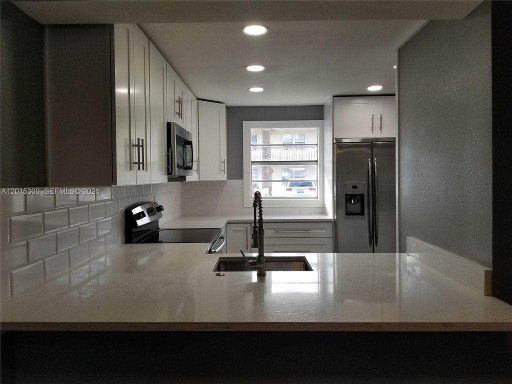 Photo of 3777 NW 78th Ave #14A, Davie, FL 33024 (MLS # A12015300)