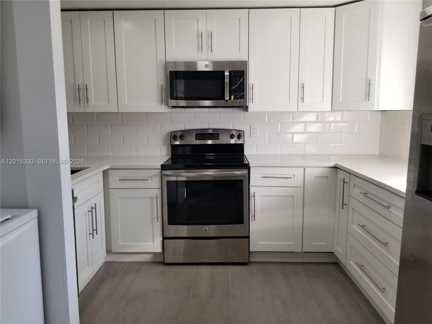 Gorgeous remodeled 2 bed 2 full baths. A must-see. Tile throughout.  Impact windows! Washer & Dryer. Enclosed balcony. Assigned parking space included. Located near busy University Drive and Sterling Road, You are close to everything. Association Fee includes Building Insurance, Water, Trash and a Club House with a Pool and Event Facility. No Commercial Vehicles Permitted