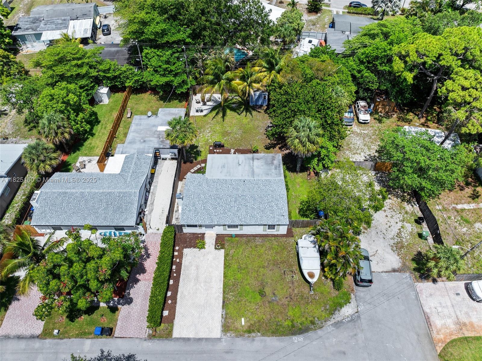 Fall in love with this charming 3-bedroom and 2 bathroom home located on a desirable corner lot in the heart of Fort Lauderdale. This beautifully updated residence features fresh paint, tile, and vinyl flooring, a cozy fireplace, stunning quartz countertops, new cabinetry, and stylish bathroom vanities. Recent improvements include a newer 2022 roof, 2020 A/C, new doors, and updated fencing. The spacious backyard offers ample room for a future pool, plus a shed and boat storage space. Just minutes from Fort Lauderdale-Hollywood International Airport, downtown, and the vibrant Las Olas Boulevard with its renowned dining, shopping, and entertainment options, this home perfectly blends comfort, convenience, & the South Florida lifestyle. Close by is a public boat dock, Cooley's Landing Marina.