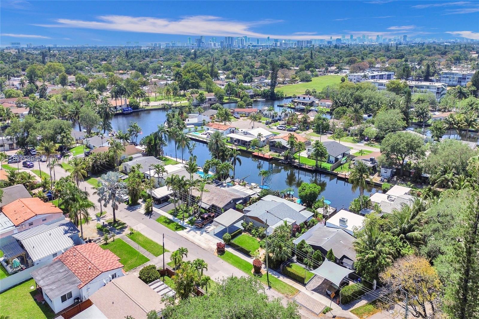 Discover a hidden gem in the heart of Hollywood — a stunning, fully remodeled 3-bed, 2-bath waterfront home that defines the ultimate South Florida lifestyle. This turnkey oasis offers luxury at every turn, with smart home technology, elegant finishes, and a chef’s kitchen featuring high-end appliances. Enjoy peace of mind with a new roof, impact doors and windows, and upgraded electrical. The oversized backyard is a tropical retreat with fruit trees, a full outdoor kitchen, room for a pool, and a direct ocean access. Lounge, entertain, or set out on the water — this home makes it all possible. It’s not just a move, it’s a hidden gem and a major lifestyle upgrade! Close to the beach, airport, Dania Pointe, Memorial Hospital and all that South Florida has to offer!