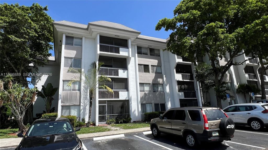 Photo of 711 N Pine Island Rd #211, Plantation, FL 33324 (MLS # A11996889)