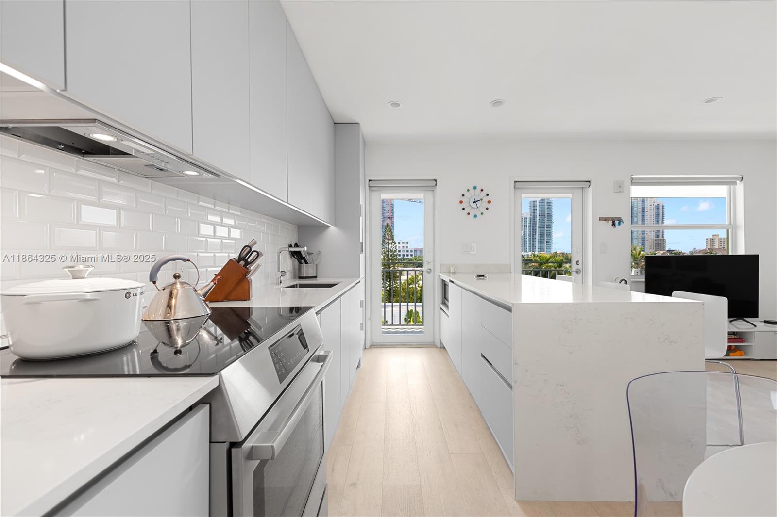 Available for high season 6 month rental with all utilities included! This incredbily redesigned residence is perched on the top floor of this sleek no-nonsense elevator building just a block from the ocean in the center of the coveted SOFI neighborhood of Miami Beach. Turnkey seasonal rental complete with all furniture and funishings (bring your own towels/bedding). One bedroom with south and north facing windows has been opened into one sunfilled space with a sliding door for those times when separation is needed. Complete with top of the line appliances, gleaming counters, in-residence washer and dryer and walk in shower with its own window! All this plus a spacious balcony with distant views of the ocean and the South Beach skyline! Flexible move in date but MUST BE AT LEAST 6 MONTHS