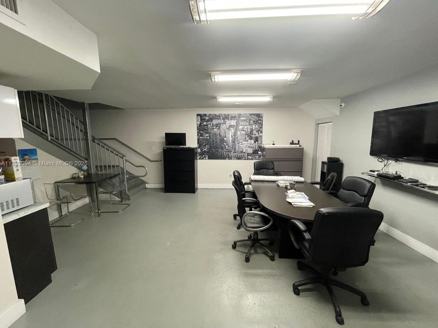 Prime office/warehouse space in the heart of Hialeah Gardens! This ground-level unit features a flexible open layout with a reception area, two private bathrooms, a kitchen/break room, and a spacious garage/warehouse area with high ceilings and roll-up door. Ideal for professional offices, showroom, or light industrial use. Conveniently located near major highways (I-75, Palmetto Expressway, and Okeechobee Rd), offering excellent accessibility for clients and staff. Ample parking, and ready for immediate occupancy!