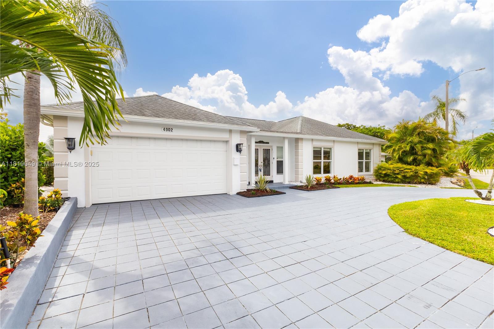Pool Service and Landscaping included in the rent. Beautiful 3-bedroom, 2.5-bathroom home in Woodlands Golf Course property. Features include a brand-new roof, full impact windows and doors and a pool for entertaining. The kitchen boasts bar seating, built-in cabinetry, and panoramic golf views. The primary suite includes two walk-in closets. This home is move-in ready.