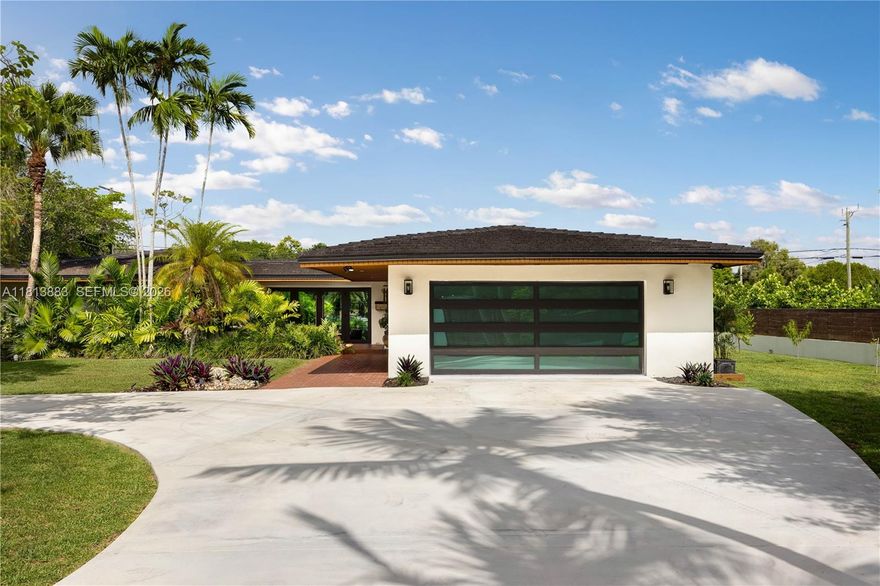 Meticulously renovated and truly turnkey, this 4-bedroom + office + TV room, 3.5-bath pool home sits on a fully fenced 25,353 SF cul-de-sac lot in the highly sought-after Baptist Hospital neighborhood. Gated for privacy and surrounded by lush landscaping, the home welcomes you with a tranquil koi pond and expansive circular driveway. Inside, a dramatic atrium courtyard fills the living spaces with natural light and tropical charm. The home features multiple living and dining areas, a custom-designed office, a fully reimagined chef’s kitchen with high end appliances, oversized eat-in island with storage, hidden walk in butler’s pantry, and a sleek laundry room. All three full bathrooms have been rebuilt with high-end finishes. Major upgrades include new hurricane-impact windows and doors (including garage), all-new plumbing and electrical, new ductwork, insulation, HVAC system, Ethernet wiring to multiple points throughout the home, smart lighting, and custom paneling. Outdoors, enjoy a resurfaced pool, landscape lighting, fruit tree grove, koi pond, and total privacy. All major systems replaced within the past 2 years. Move-in ready and built to the highest standard.