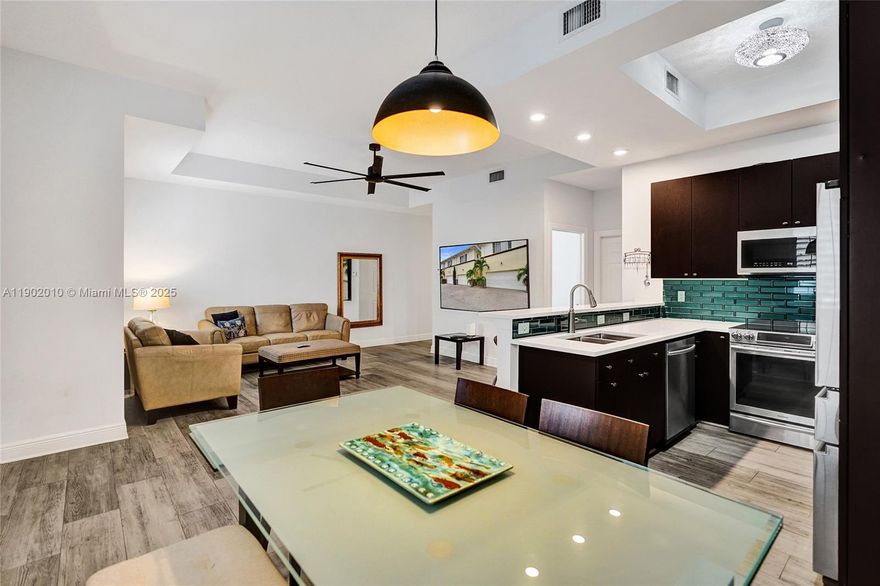 Ask me about the rent to own option! Experience luxurious townhouse living in the heart of Lake Worth Beach with this beautifully renovated three-bedroom, two-and-a-half-bath home. The open-concept main level features elegant plank-style tile flooring (2020) and a chef’s kitchen with quartz countertops, a subway tile backsplash, and stainless steel appliances. Upstairs, all bedrooms showcase updated flooring (2021), while the primary suite offers two custom walk-in closets (2023) and a spa-inspired bathroom completely redesigned in 2021. Additional upgrades include a two-car garage, a whole-house carbon water filter and softener system (2023), a new water heater (2023), new HVAC (2022), impact windows, and plantation shutters throughout.