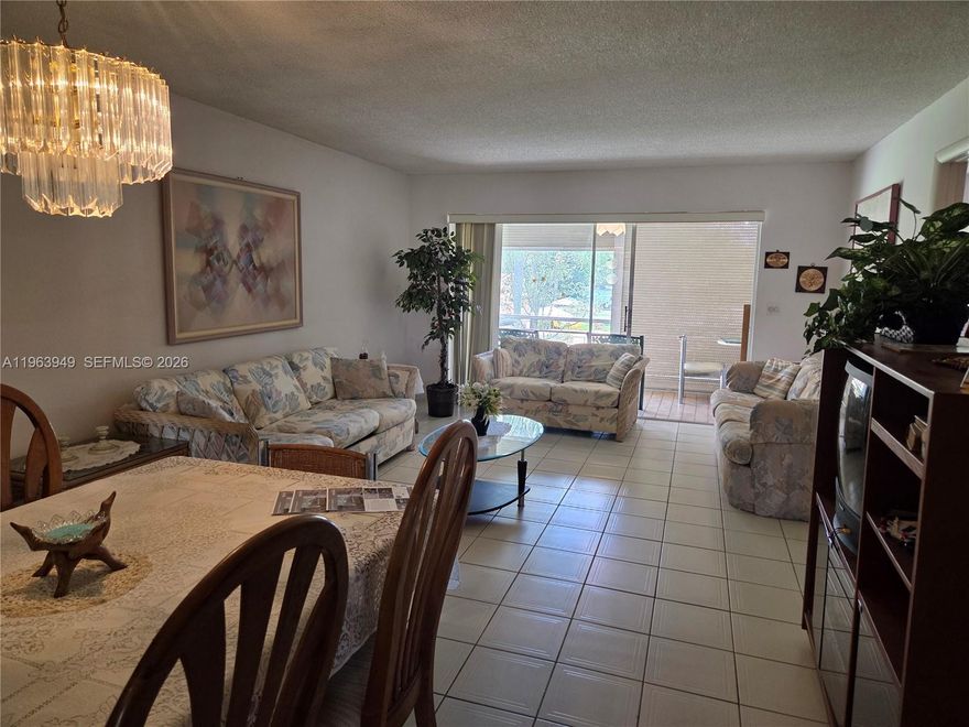 Spacious 2-bedroom, 2-bathroom second-floor condo located in a desirable 55+ community in Tamarac. This unit offers a functional split-bedroom floor plan with generous living and dining areas, tile floor throughout, providing plenty of space to make it your own. The primary suite features ample closet space and a private bath with combination tub/shower. In original condition, this property presents a great opportunity for buyers looking to update and customize to their personal taste. Enjoy peaceful views and natural light from the second-floor setting. Screened-in balcony overlooking the pool. Community amenities and well-maintained grounds enhance the lifestyle experience. Association requires at least one occupant to be 55+ and a minimum credit score of 680. Conveniently located near shopping, dining, and major roadways. For golfers, Colony West Golf Course is across the street.