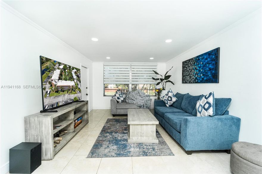 Tired of high rental prices? come & see this ready to move in 2/2 unit in 2nd floor. Garden view with beautiful enclosed Florida room. Fully remodeled Kitchen w beautiful white granite countertop. Serene Garden setting with gorgeous canals throughout. Recent upgrades: 20x20 Ceramic tile with 6' baseboards, hardwood floors, Samsung washer & Dryer, Stainless refrigerator, dishwasher, Microwave, cooktop & oven. (no age restriction, no lease allowed) Association fees includes: Building Insurance, water, trash & sewer, landscaping, BBQ area, pest control, 2 pools, Gym, tennis court, community center, Building camera surveillance, 1 assigned parking but plenty guest, 25% down pmt, 40 yr building passed.