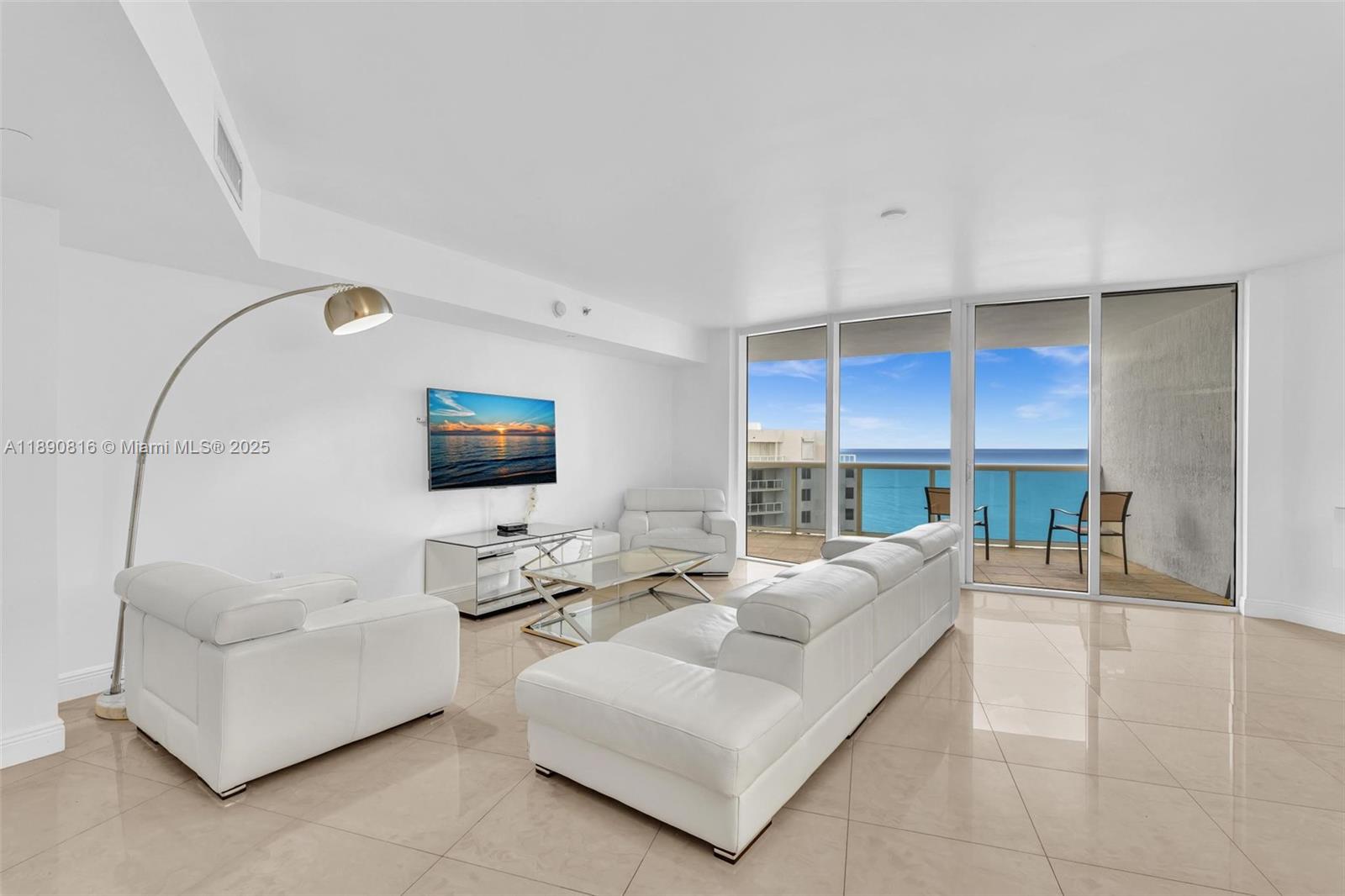 Experience oceanfront luxury at its finest in this stunning FURNISHED 2 bedroom plus den residence at Ocean Four. The open concept layout seamlessly blends the living, dining, and chef’s kitchen, all framing panoramic views of the Atlantic through floor to ceiling glass. Enjoy sunrise coffee or sunset cocktails from two spacious terraces facing east and west. The sleek kitchen features premium Miele and Sub-Zero appliances, a center island and custom cabinetry. The primary suite offers a spa inspired bath with jetted tub and glass shower. Building amenities include full beach service, pool, spa, gym, yoga studio, restaurant and 24 hour concierge. Steps from parks, cafes and the pier, minutes to Bal Harbour and Aventura.