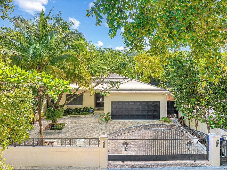 OWNER FINANCING AVAILABLE!  Experience luxury living in this stunning Florida Ranch home nestled in the heart of Coconut Grove. This beautifully renovated property features over 3,000 sq ft of sophisticated living space, complete with 3 spacious bedrooms and 4 bathrooms. The chef's kitchen is a culinary dream, boasting a high-end gas stove and sleek finishes. Each room is protected with impact glass, ensuring peace and safety. Situated on a large, gated lot, this home offers privacy and an expansive outdoor area with a pristine pool perfect for entertaining and relaxation. The property includes 2 car garage and is ideally located next to a neighborhood children's park, adding to its family-friendly appeal. Don't miss out on this exquisite Coconut Grove gem!