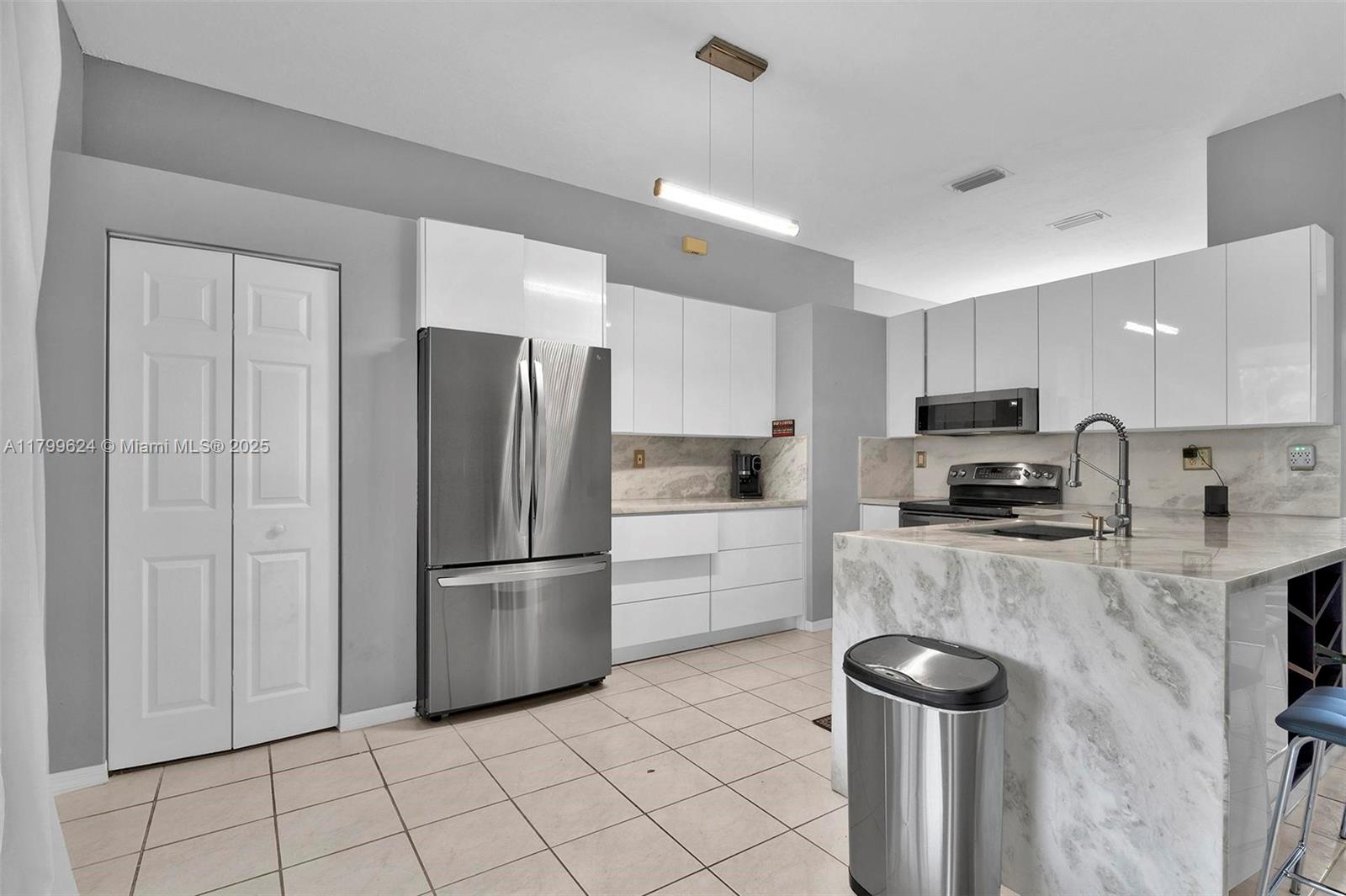 Welcome to this beautifully updated 3bed/2bath Single family home in the desirable Keys Gate community of Homestead! Boasting 1,573 sq ft of living space, this home features a spacious split floor plan, high ceilings & plenty of natural light throughout. The updated kitchen includes an oversized quartz countertop perfect for cooking & entertaining! Bathrooms have been tastefully remodeled & maintained. Enjoy tile flooring throughout w/ vinyl in the bedrooms for added comfort. Relax in the screened-in patio & of the convenience of a 2-car garage. Located near top-rated schools, shopping centers & just a short drive to the stunning Florida Keys!! HOA fee includes Landscaping, Cable, Wifi & Alarm system. Resort-like amenities include oversized pool, tennis courts & much more! Priced to Sell!